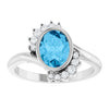 Platinum Oval London Blue Topaz Ring with 1/8 CTW Natural Diamonds