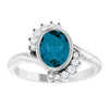 Platinum Oval London Blue Topaz Ring with 1/8 CTW Natural Diamonds